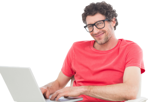 Smiling businessman using laptop over white background