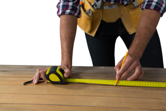 Carpenter measuring wooden plank - Powered by Adobe