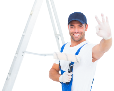 Happy handyman with paint roller gesturing okay