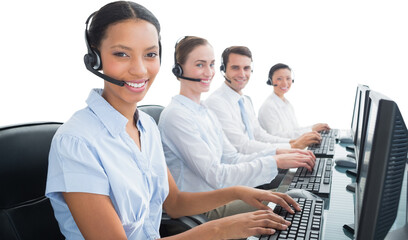 Business people with headsets using computers 