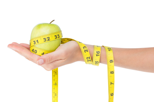 Woman holding an apple with tape measure  - Powered by Adobe