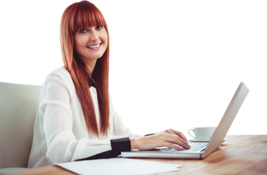 Smiling hipster businesswoman using her laptop - Powered by Adobe
