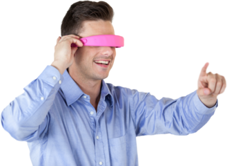 Smiling young man gesturing while using virtual reality headset