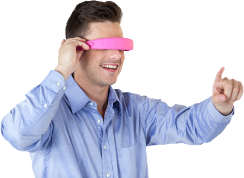 Smiling young man gesturing while using virtual reality headset