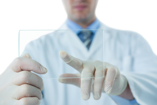 Male doctor using futuristic glass