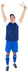 Football player celebrating victory with arms raised