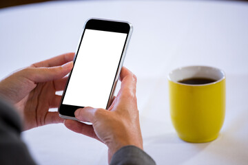 Woman using cell phone at table