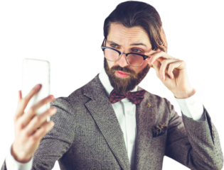 Businessman taking selfie through mobile phone