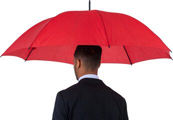 Rear view of businessman carrying red umbrella 