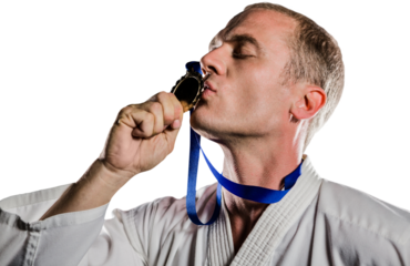Fighter kissing his gold medal