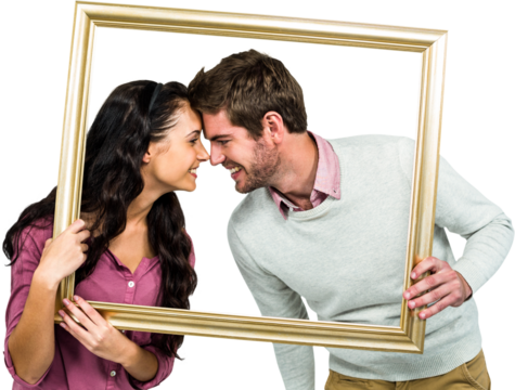 Happy couple holding picture frame