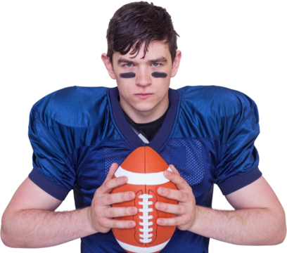 Determined american football player holding a ball