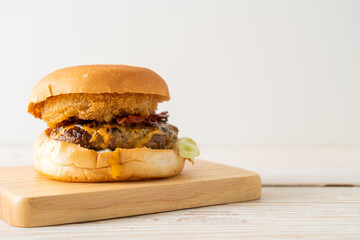 beef burger with cheese, bacon and onion rings