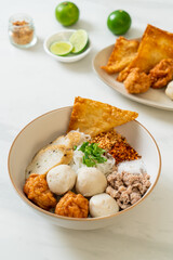 spicy small flat rice noodles with fish balls and shrimp balls without soup