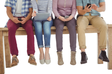 Low section of business people sitting on desk 