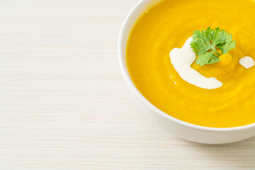 pumpkin soup in white bowl