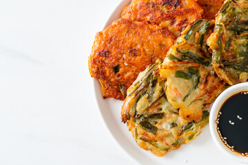 Pajeon or Korean pancake and Korean Kimchi pancake or Kimchijeon on white background