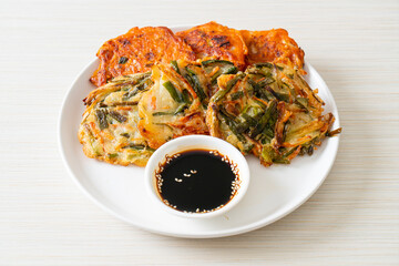 Pajeon or Korean pancake and Korean Kimchi pancake or Kimchijeon on white background