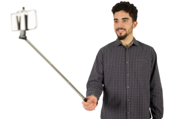 Casual man using a selfie stick