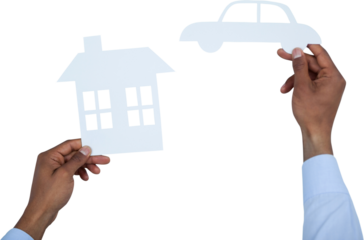 man holding a car and a house in paper