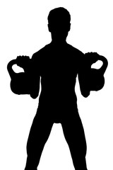 Man exercising with kettlebells