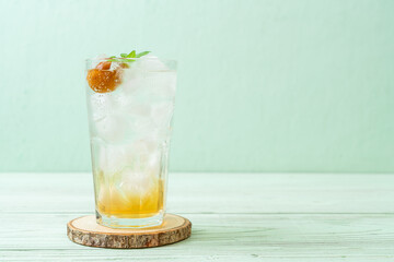 iced plum juice with soda and peppermint