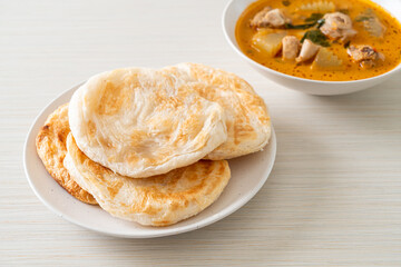 Chicken curry soup with roti