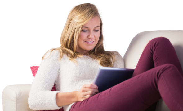 Pretty blonde relaxing on the couch with tablet - Powered by Adobe