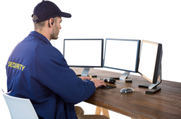 Focused security officer using computer