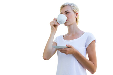 Attractive blond woman drinking hot beverage