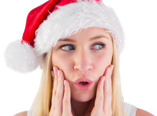 Festive blonde looking surprised with hands on face