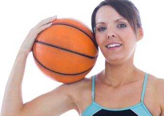 Portrait of happy woman holding basketball on shoulder
