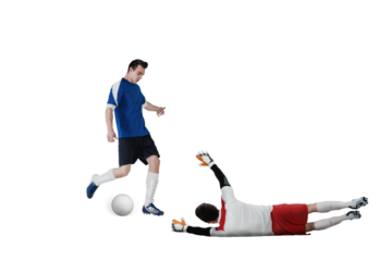 Football players tackling for the ball