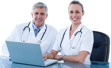 Portrait of male and female doctors with laptop