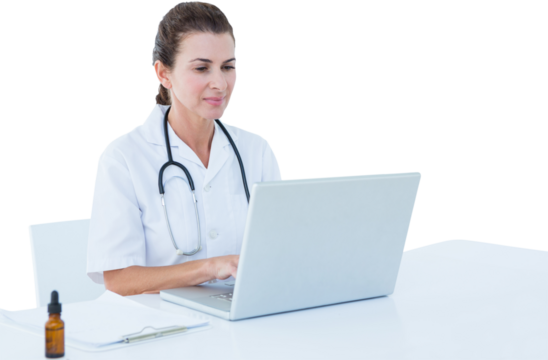 Female doctor using laptop at table