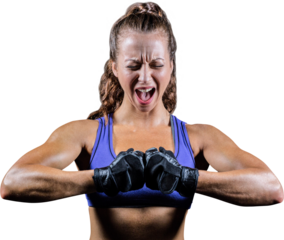 Aggressive female boxer flexing muscles