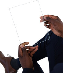 Low section of businessman using glass interface