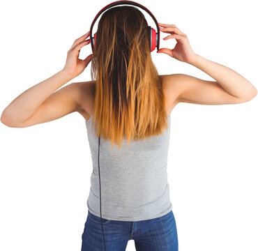 Woman listening music through headphones
