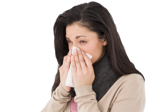 Sick brunette blowing her nose