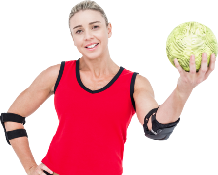 Female athlete with elbow pad holding handball - Powered by Adobe