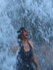 Woman in the waterfall