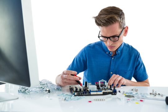 Computer technician repairing motherboard - Powered by Adobe