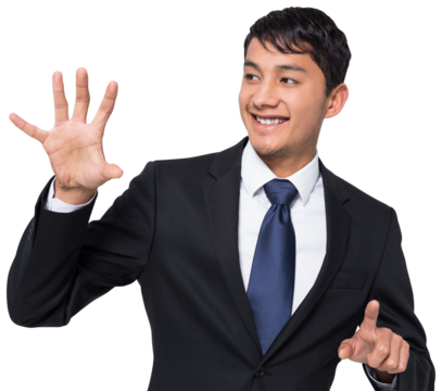 Smiling businessman holding and pointing