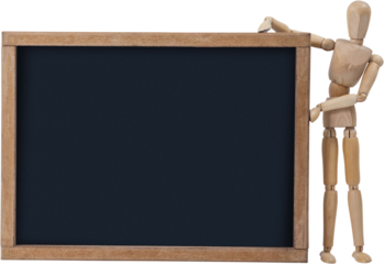 Wooden 3d figurine standing beside slate board