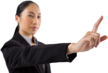 Businesswoman pressing an invisible virtual screen