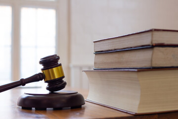 wooden judge gavel on table as symbol of justice for use in legal cases judicial system and civil...