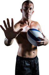 Handsome shirtless sports player showing hand while holding ball