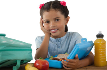 Smiling girl with lunch box at table