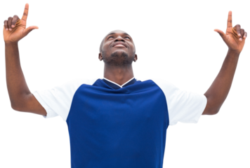 Football player pointing upwards and cheering