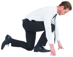 Businessman with hands and one knee on the floor